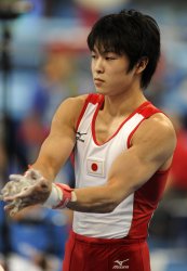 Japanese gymnast Uchimura on the horizontal bar in men's gymnastics qualification in Beijing