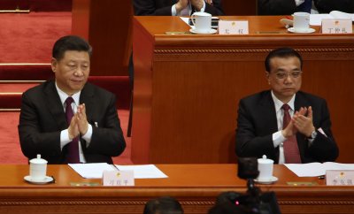 Xi and Li applaud during the NPC in Beijing, China