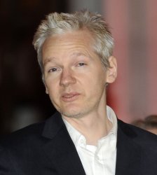 Julian Assange speaks to the media after gaining bail in London