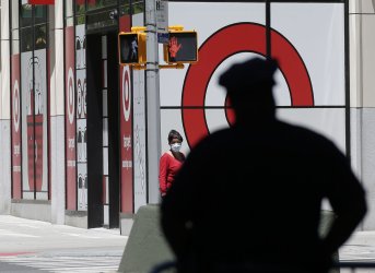 An NYPD Police officer stands by a Target retail store in New York