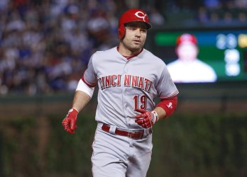 Reds Joey Votto runs the bases after hitting a two-run home run in Chicago