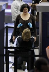 TSA pats down passenger at O'Hare Airport in Chicago