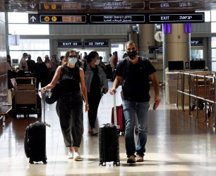 People Wear Protective Masks In Ben Gurion International Airport