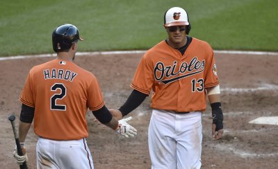 Baltimore's Manny Machado scores the winning run against the Los Angeles Angels
