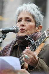 Joan Baez performs for Occupy Wall Street protesters who hold a Veterans Day concert in New York
