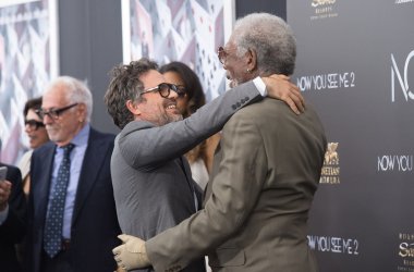 Mark Ruffalo and Morgan Freeman embrace as they arrive at the "Now You See Me 2" World Premiere