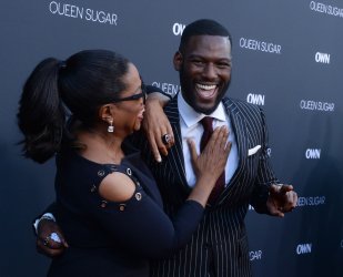 Oprah Winfrey and Kofi Siriboe attend OWN's "Queen Sugar" premiere in Burbank, California