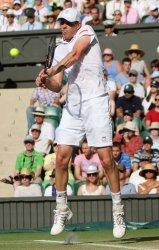 Sam Querrey plays a backhand at the Wimbledon Championships