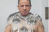 Man balances 85 spoons on his body at once for Guinness World Record