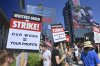 Screenwriters reach tentative deal with studios to end strike