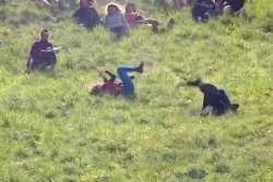 Woman wins annual cheese-rolling race while unconscious