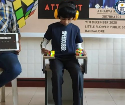 8-year-old uses hands and feet to break Rubik's cube world record