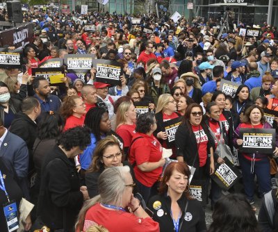 Crowds of Thousands Gather in Downtown Los Angeles to Support Striking WGA Employees