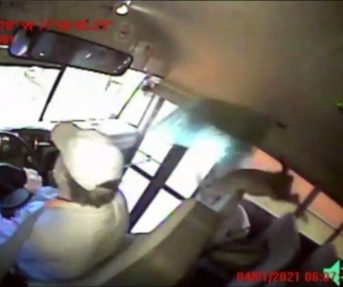 Deer crashes through school bus windshield, wakes sleeping student