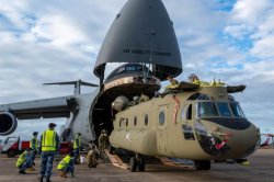 C-5 Galaxy cargo plane carries Chinook helicopters from U.S. to Australia