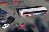 Four injured, one critically, after bus crashes through Calif. parking lot