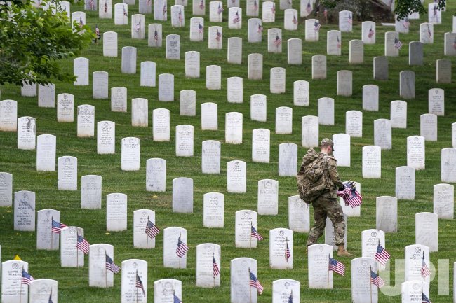 Arlington National Cemetery Hosts Annual Flags-In Event Ahead of Memorial Day