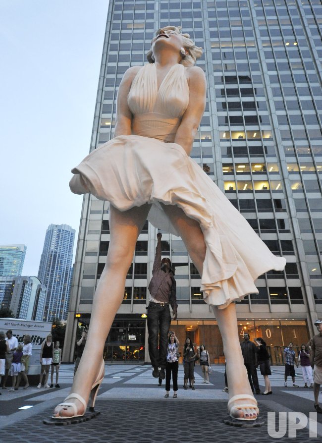 Sergio Rockstar leaps under Giant Marilyn Monroe Sculpture in Chicago