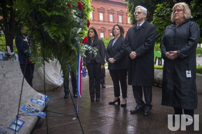 Attorney General, Deputy Attorney General And Associate Attorney General lay wreath at Law Enforcement Officers Memorial in Washington DC