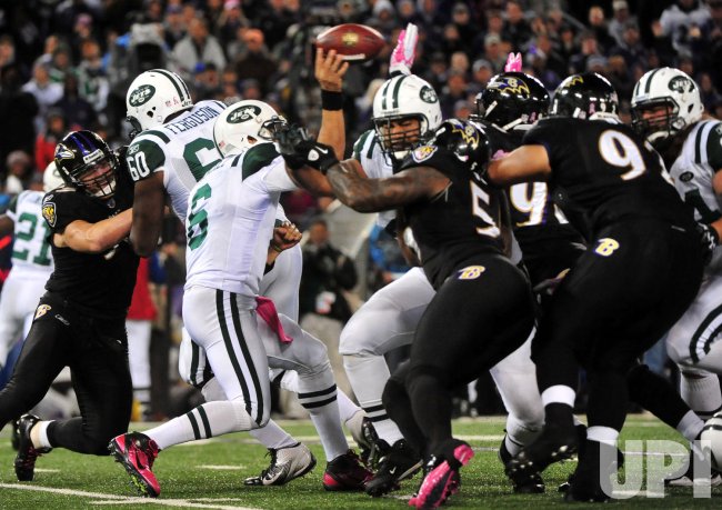 Jets quarterback Mark Sanchez passes under heavy pressure in Baltimore