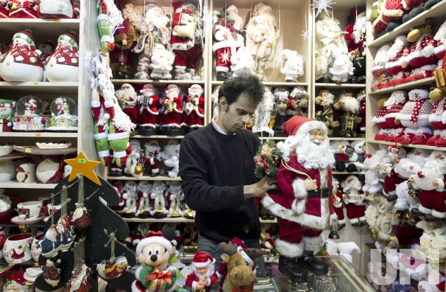 An Iranian shopkeeper works in a Christmas shop in Iran