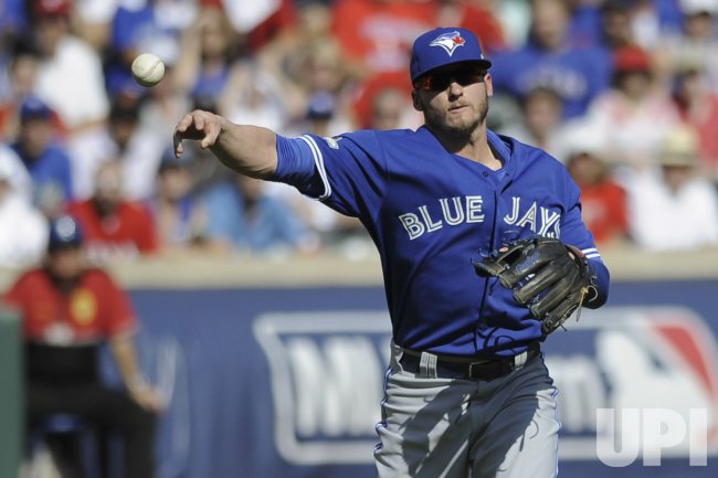 Toronto Blue Jays infielder Josh Donaldson throws out Texas Rangers Delino DeShields