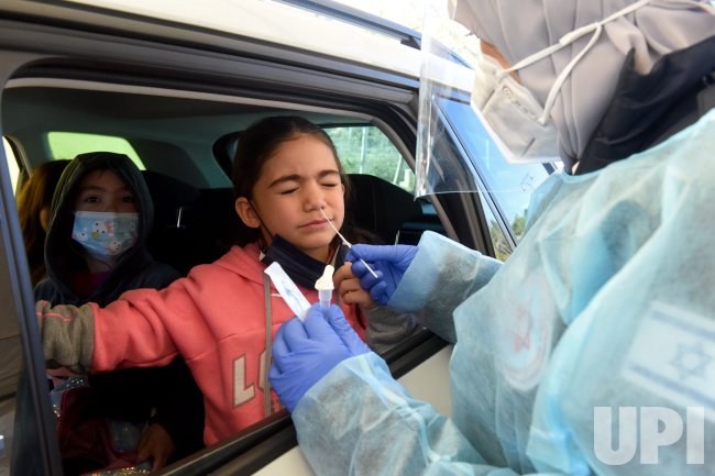 A Medical Worker Administers A COVID-19 Test To An Israeli Girl