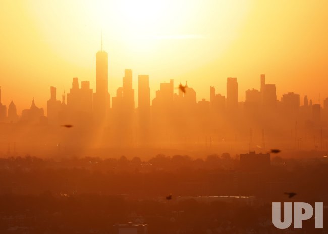 Sunrise Behind Manhattan Skyline in New York