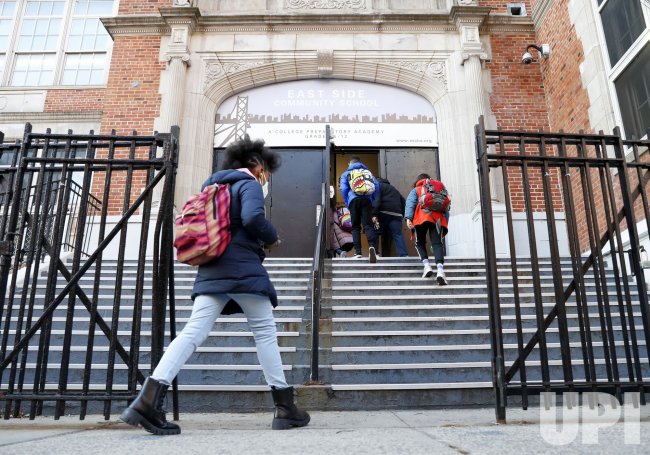Students Enter the Eastside Community School in New York