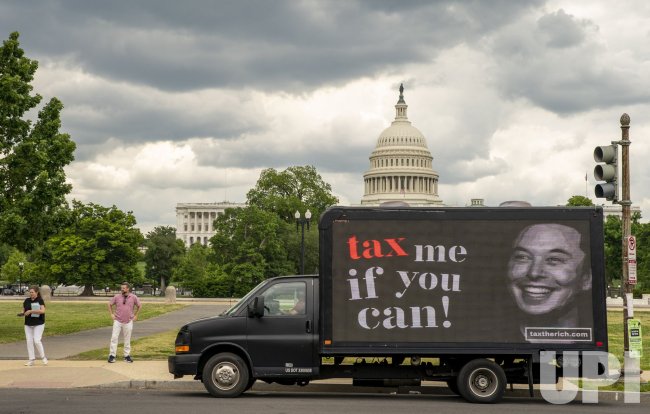 "Tax me if you can" Billbaord at US Capitol