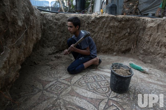 Palestinian Farmer Cleans Byzantine Mosaic Floor He Discovered on his Farm in Gaza