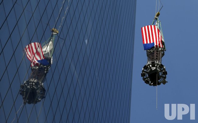 Final piece of spire raised to top of One World Trade Center