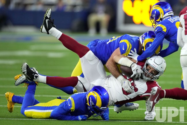 Arizona Cardinals Zach Hertz is Tackled by Rams Troy Reeder at SoFi