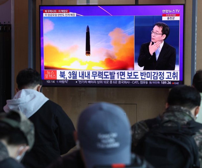 North Korea fires two missiles as U.S. aircraft carrier arrives