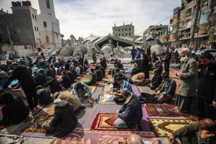 Palestinians pray near destroyed mosque in Rafah
