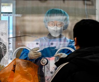 Amid Omicron surge, South Korea shifts to at-home COVID-19 care