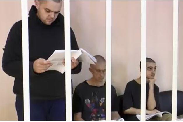 Britons Aiden Aslin and Shaun Pinner with Moroccan Brahim Saadoun, who were captured after the siege of the the Azovstal steel plant in Mariupol. Screen shot via Supreme Court of the self-proclaimed Donetsk People's Republic