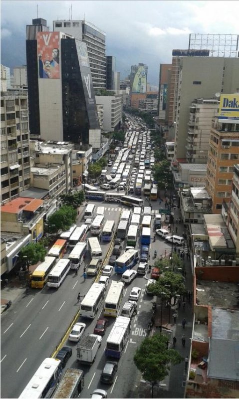 Bus drivers in Caracas, Venezuela, blocked streets for about 8 hours on Wednesday to protest against the economic crisis in the country under the administration of former bus driver President Nicolas Maduro. Photo courtesy Ricardo Molina/Twitter