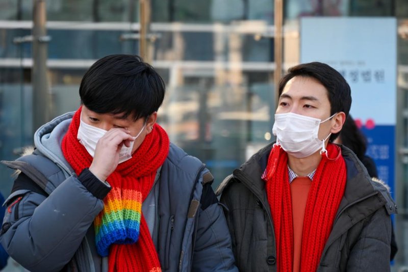 Same-sex partners So Seong-wook (L) and&nbsp;Kim Yong-min lost their lawsuit Friday&nbsp;against South Korea’s national health insurer over its withdrawal of spousal benefits from So. Photo by Thomas Maresca/UPI