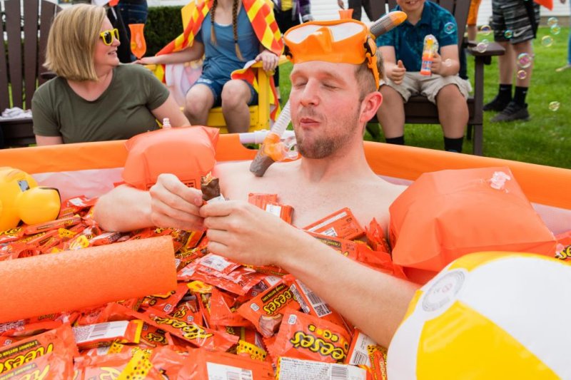 The makers of Reese's candies presented superfan Jon Ernst with a pool filled with chocolate and peanut butter candies to celebrate his viral fame. Photo courtesy of The Hershey Company
