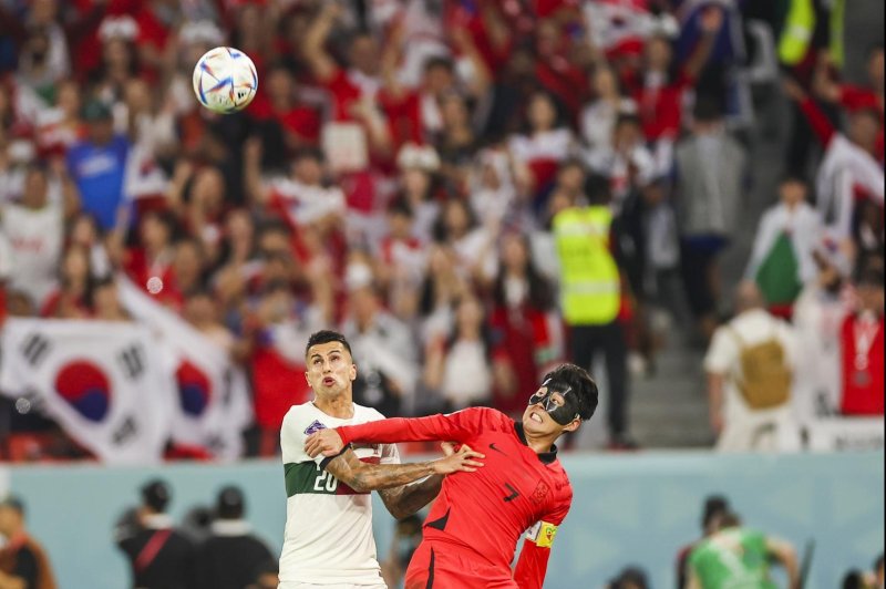 South Korea's Son Hueng-Min faces off against Portugal's Joao Cancelo in the World Cup group H qualifying match on Friday. Photo by Jose Sent Goulao/EPA-EFE