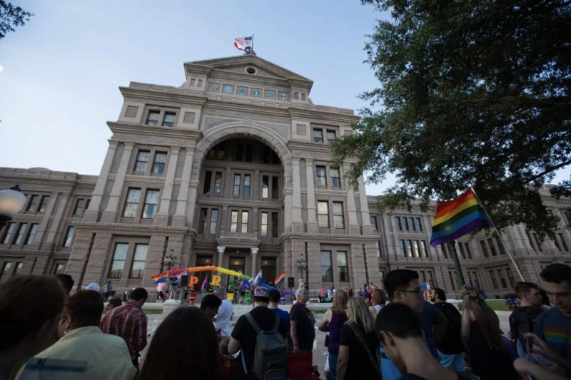 Activists and members of Austin’s LGBTQ community gathered on the steps of the capitol in 2017 to celebrate the anniversary of the 1969 Stonewall riots. A Texas judge on Friday temporarily blocked the state from some investigations into gender-affirming care for transgender kids. File Photo by Austin Price/The Texas Tribune