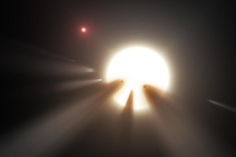 An artistic rendering shows the glow of a star is interrupted by passing comets. Photo by NASA/JPL
