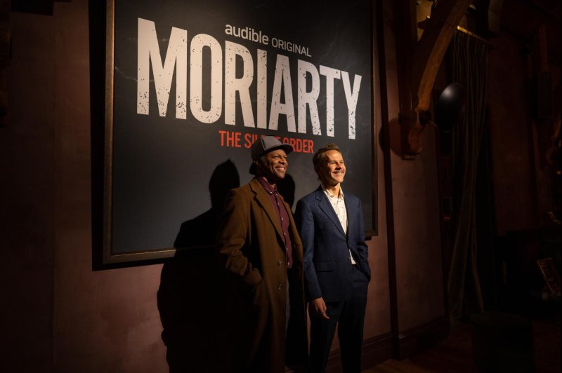 Phil LaMarr (L) and Dominic Monaghan attend a celebration for Season 2 of "Moriarty" in New York Thursday night. Photo by Ryan Kelly/Audible
