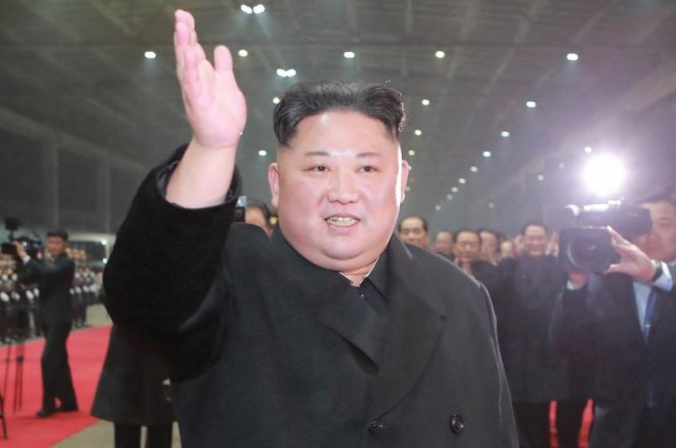 A photo released by the official North Korean Central News Agency shows North Korean leader Kim Jong Un waving to a crowd upon arrival at home early Tuesday. Photo by KCNA/EPA-EFE