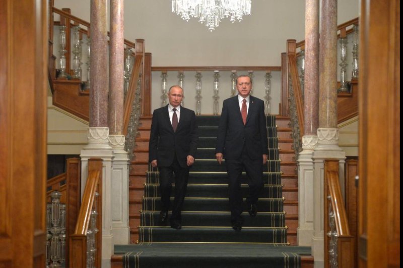 Russian President Vladimir Putin, at left, and Turkey's President Recep Tayyip Erdogan, right, arrive for a joint press conference following their talks on the sidelines of the 23rd World Energy Congress, in Istanbul, on Monday where they agreed to revive a pipeline project running from Russia, through Turkey to Greece. Photo by EPA/ALEXEI DRUZHININ/SPUTNIK/KREMLIN POOL