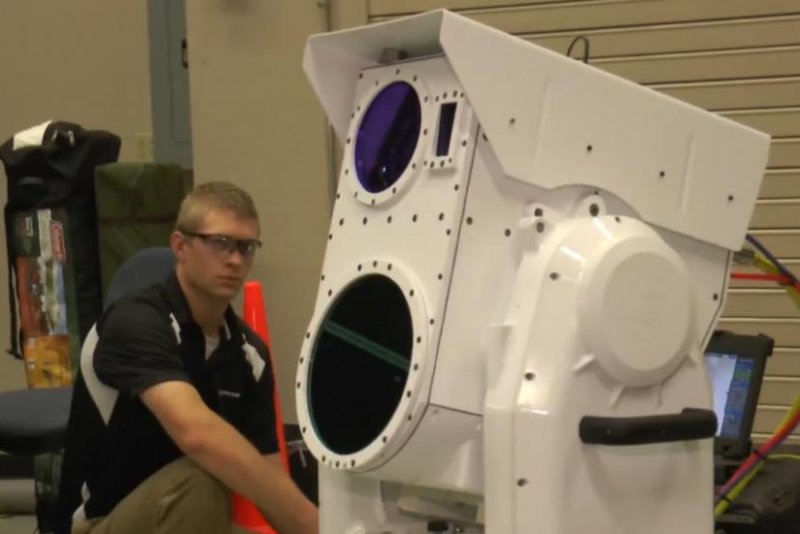 Boeing engineer Isaac Neil demonstrates the aerospace company's new compact laser weapons system. Screenshot from Boeing