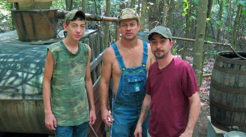 Tickle, with his "Moonshiners" cast mates. (<a class="tpstyle" href="http://dsc.discovery.com/tv-shows/moonshiners/about-this-show/moonshiners-about-show.htm" target="_blank">Credit: Discovery Networks</a>)