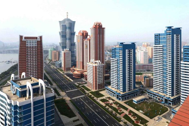 A 53-story apartment tower, seen in the far left corner, is the new pride of North Korea. Pyongyang’s state media outlet has touted the building as a construction miracle, and has said the tower took six months to complete. File Photo by KCNA