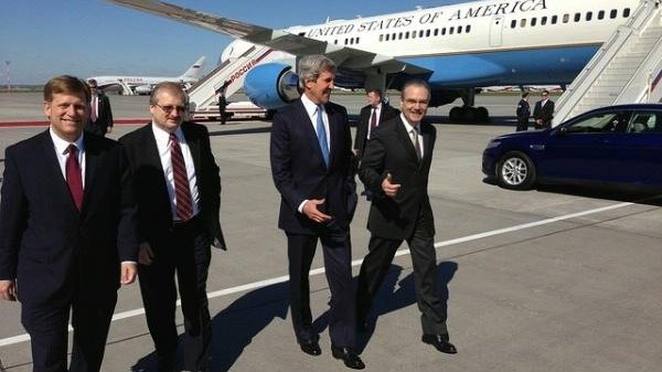 Secretary of State John Kerry walks with Ambassador Michael McFaul, far left, and Russian officials after his plane landed in Moscow ahead of meetings with President Vladimir Putin and Foreign Minister Sergey Lavrov on May 7, 2013. (State Department photo)